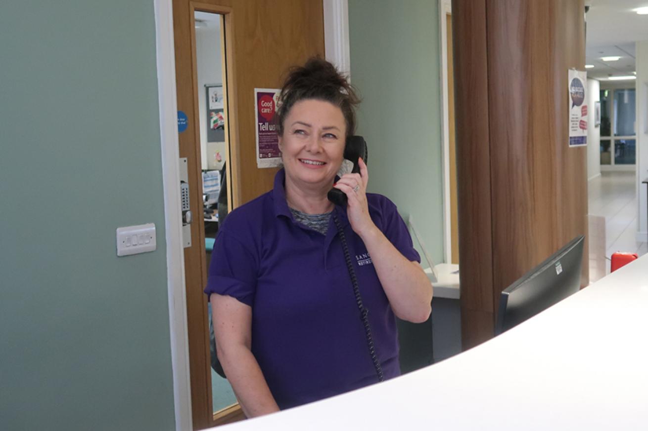 Sanctuary Supported Living employee answering the telephone