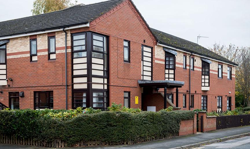 Red and yellow brick facility containing 10 fully furnished bedrooms, providing short-term and longer-term support, at Aldam House and Cottage.
