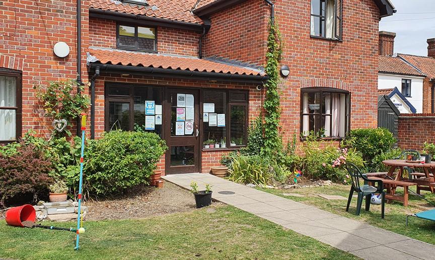 A statement brick-built residence, with different elevation levels and clay roof tiles. With an inviting front garden, consisting of seating area and homely plants.
