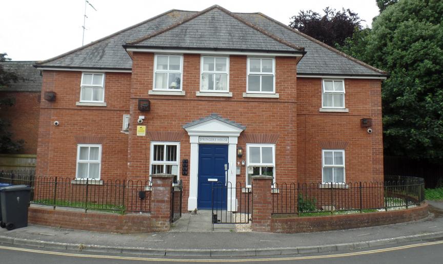 Graceful property with prominent featured blue door and white framework. An array of security features, including cameras, multiple lighting and a secure door.
