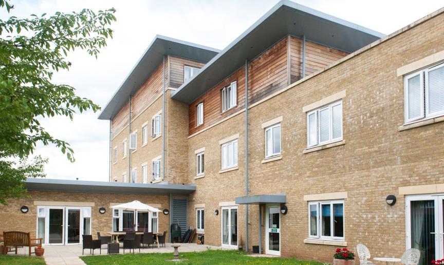The multi elevational building uses a mixture of yellow brick and wooden panelling to create a step effect to the property. The property goes from a two storey into a three storey and finally into a four, a single storey elevation links out onto the patio garden area.