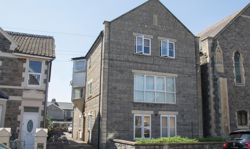Charming limestone supported housing property at Moorland Road, with left side driveway access to rear parking.