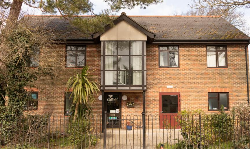 Large detached property with prominent second storey central window and added pointed roof feature. Which sits above the main entrance to the Old Milton Road shared house.