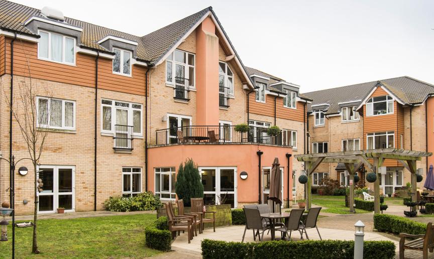 The considerably sized retirement living complex. The complex creates a corner plot for the property leaving it with a sizeable garden area with plenty of seating options and natural space. A outdoor balcony area has been built on top of the ground floor protruding elevation.