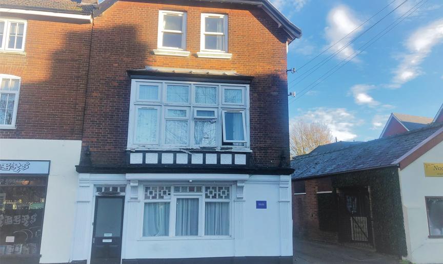Three storey brick and rendered end of terrace property. With access to the right hand side.