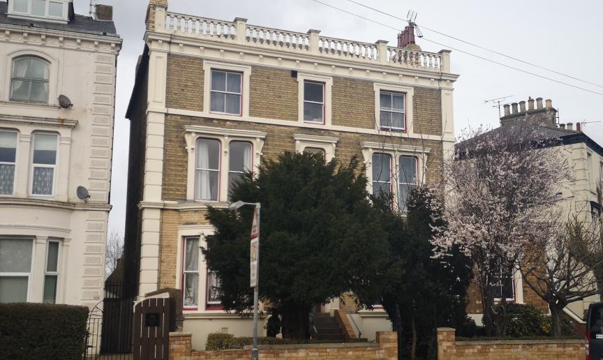 Georgian styled, three storey, detached  property with stepped access to the entrance and gated side entry.