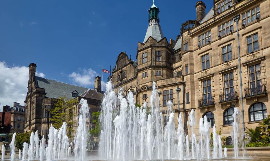 Active water fountain in front of the neo-Gothic building of Sheffield Town Hall.  