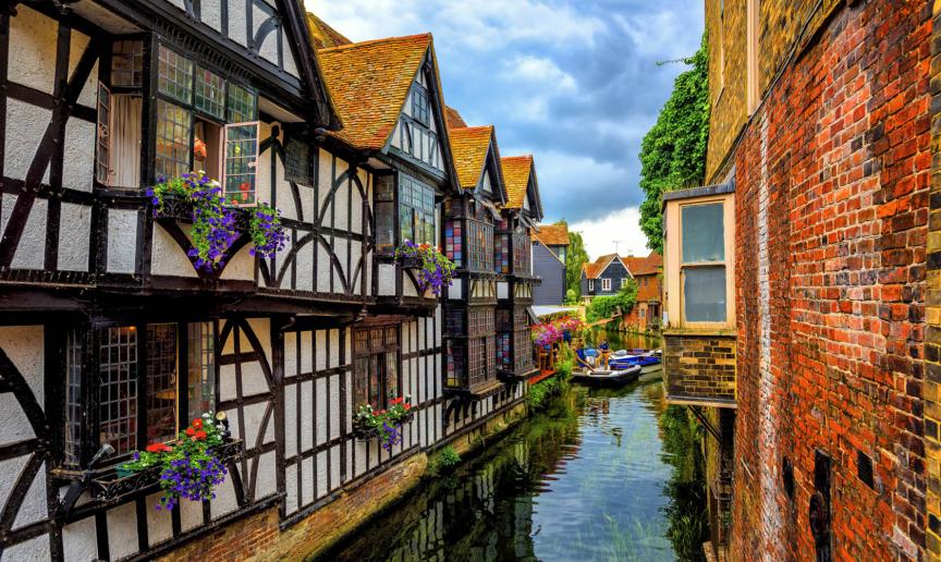 Medieval half-timber houses built on the river with boat access and mooring.