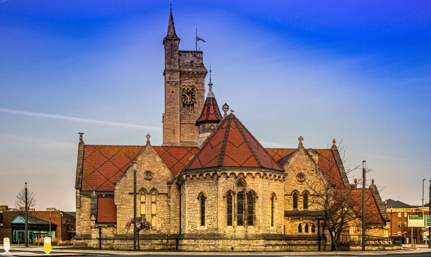Christ church a 19th Century church, built from natural stone and decorative red roofing turrets. 