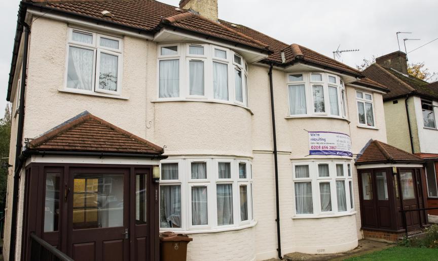 Semi-detached, white rendered residential care property at High Worple.  