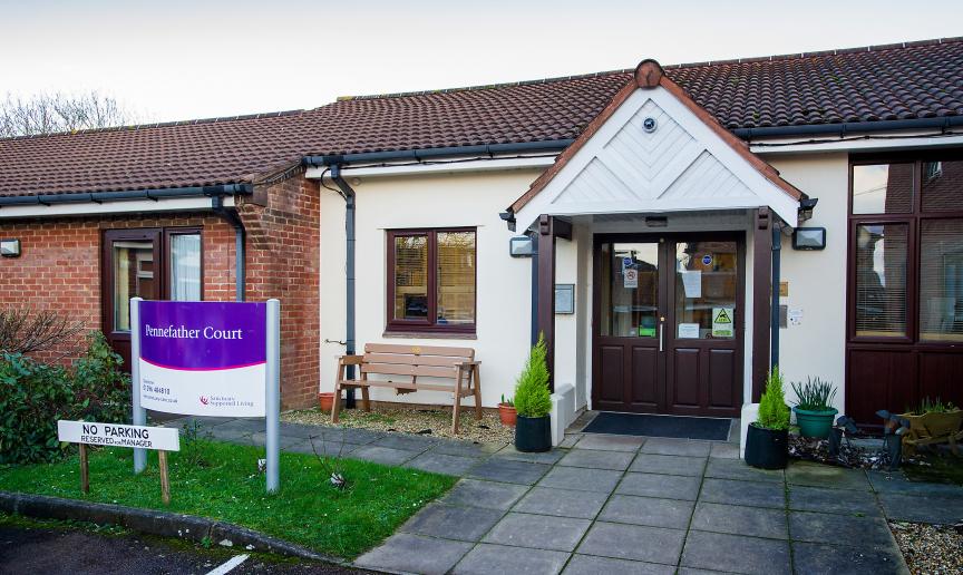 Single storey rendered, and brick built residential care home, Pennefather Court. The setback entryway has an enticing feel with the ageless brown and white décor. 