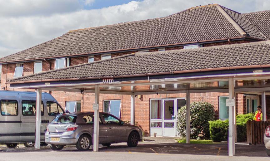 Large two storey residential care and supported living facility at Shaftebury Place. With easy dropped curb access and extended covered porch. 