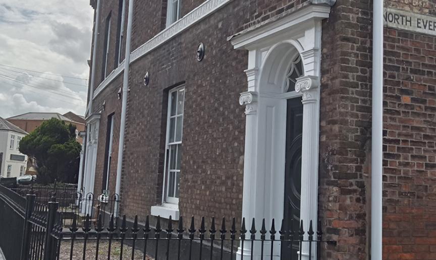 Exterior image of Merchant Terrace a dark bricked townhouse 