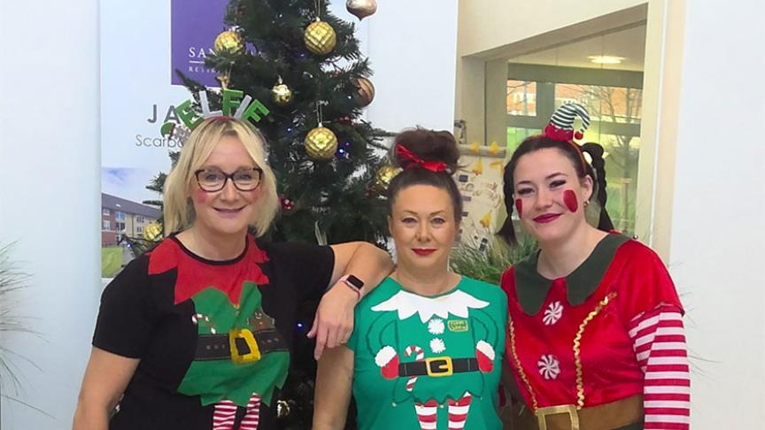 The team at Jazz Court wearing Christmas outfits