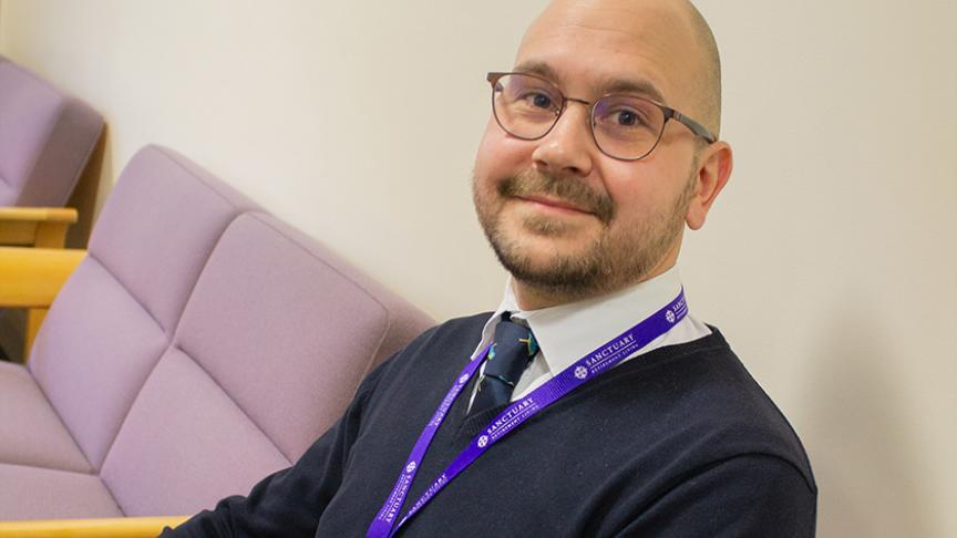 Care Quality Commission (CQC) Co-ordinator, pictured seated in a Sanctuary office