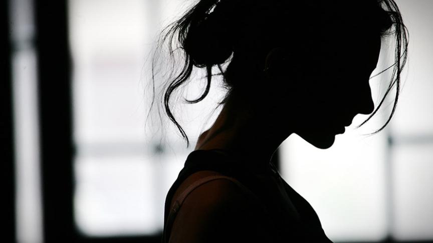 Silhouette of a woman with her hair tied up