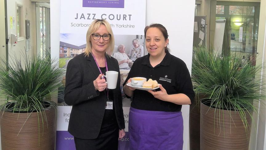 Hannah Sykes and Liz Jones holding tea and cakes at Jazz Court