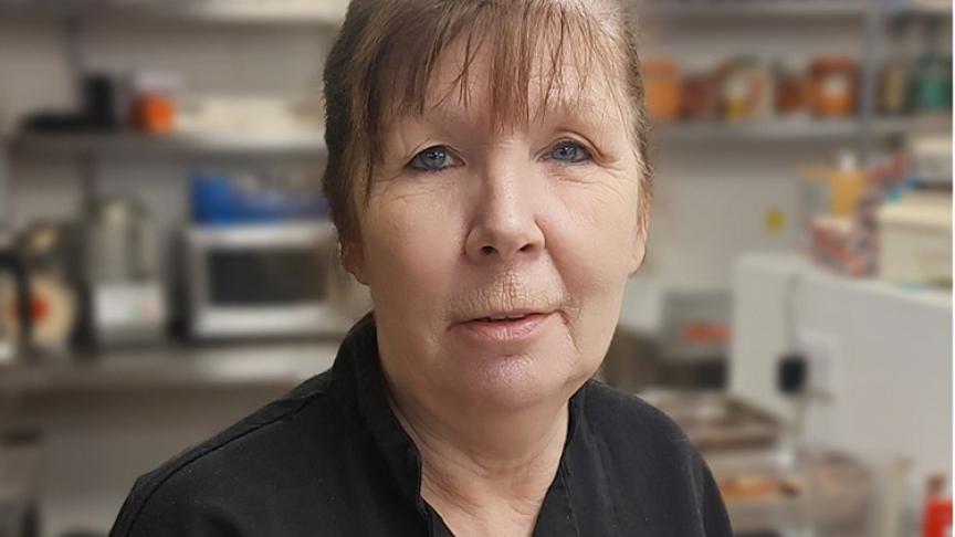 Chef Manager at Poplar House, photographed in chef's overalls in a SSL scheme kitchen