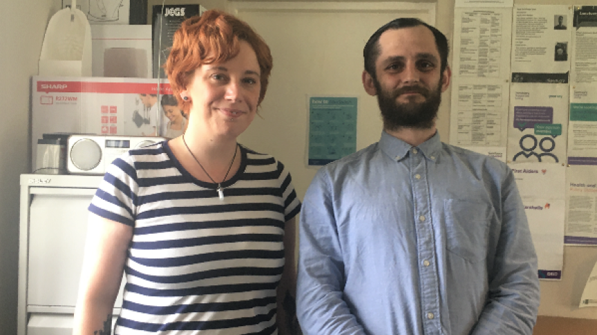 Staff member with resident photographed in a scheme's office