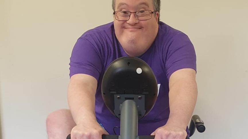 Tilmore Gardens resident exercising on an exercise bike 