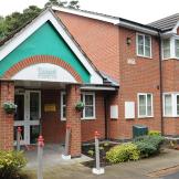 End of road, well-presented modern residential home with plenty of plants and flowers decorating the perimeter.
