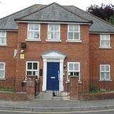Graceful property with prominent featured blue door and white framework. An array of security features, including cameras, multiple lighting and a secure door.