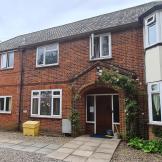 Traditional brick-built residence with rendered protruding bay windows, offering supported housing to any homeless or at risk of homelessness in Norwich. 