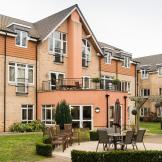 The considerably sized retirement living complex. The complex creates a corner plot for the property leaving it with a sizeable garden area with plenty of seating options and natural space. A outdoor balcony area has been built on top of the ground floor protruding elevation.