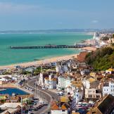 Birds eye view overlooking the seaside town of Hastings and the turquoise English Channel.