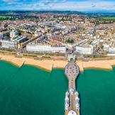 Scenic view of the turquoise sea surrounding the grand pier and town of Eastbourne.