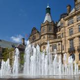 Active water fountain in front of the neo-Gothic building of Sheffield Town Hall.  