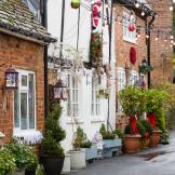 Vintage Christmas street scene decorate the characteristic brick built terraced properties either side of the uphill walkway.