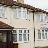Semi-detached, white rendered residential care property at High Worple.  