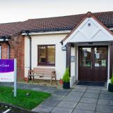 Single storey rendered, and brick built residential care home, Pennefather Court. The setback entryway has an enticing feel with the ageless brown and white décor. 