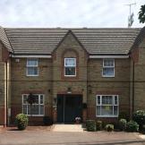 The broad property has a setback entrance way lined with small shrubbery plants providing entry to the young parents supported housing in Southend on Sea.  