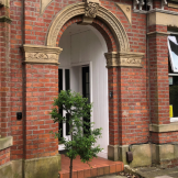 Red bricked entrance to Albert Road